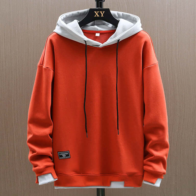 Men's two-tone comfort hoodie, modern colorblock design, relaxed fit pullover for casual streetwear style.