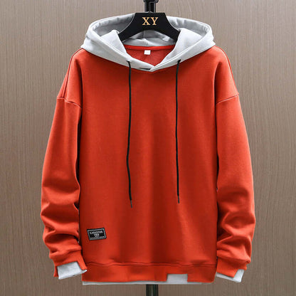 Men's two-tone comfort hoodie, modern colorblock design, relaxed fit pullover for casual streetwear style.
