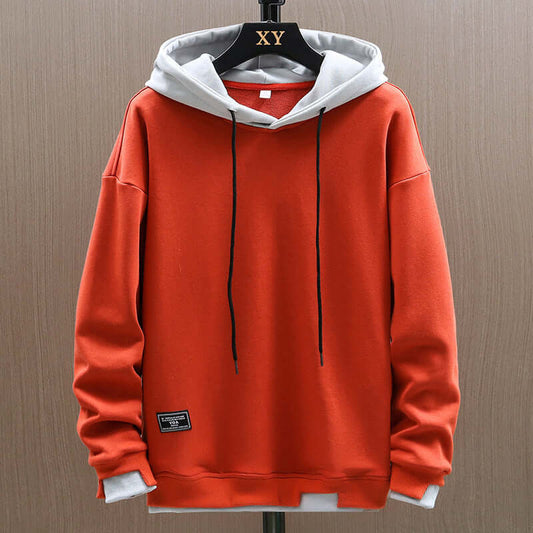 Men's two-tone comfort hoodie, modern colorblock design, relaxed fit pullover for casual streetwear style.