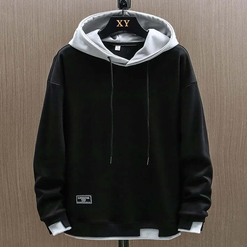 Warm men's two-tone pullover hoodie in a relaxed fit, perfect for everyday casual wear & comfort.