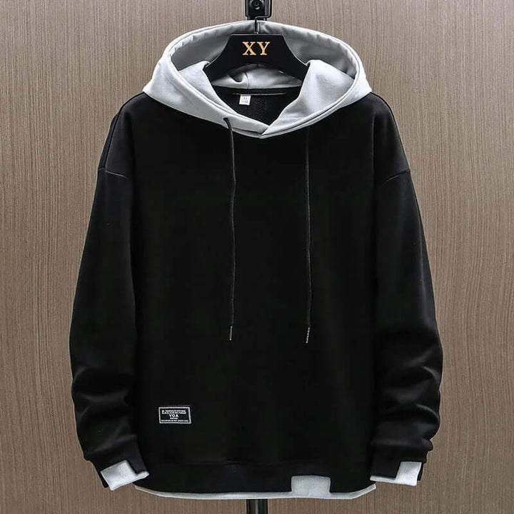 Warm men's two-tone pullover hoodie in a relaxed fit, perfect for everyday casual wear & comfort.