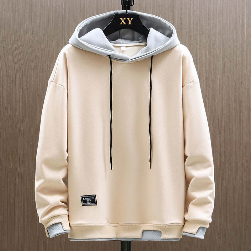 Modern men's two-tone hoodie, relaxed fit pullover, ideal for comfort, casual wear, and everyday style.