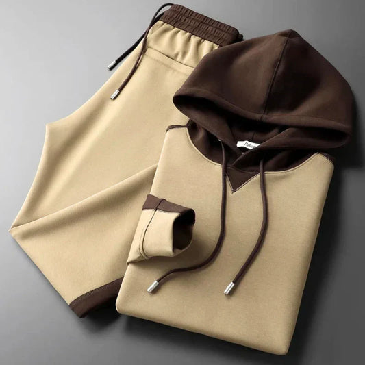 Men's two-tone lounge set with crewneck top & joggers. Comfortable, stylish athleisure for relaxation.