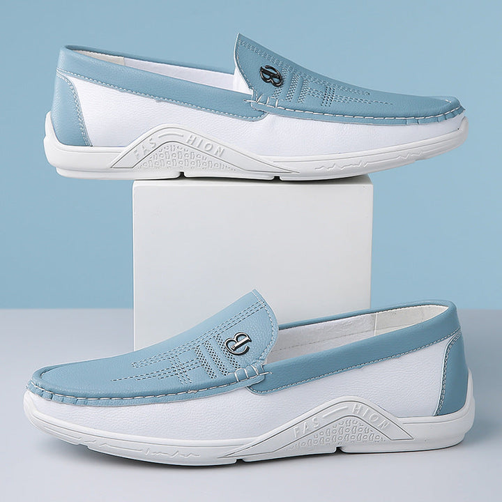 Smart casual men's two-tone loafers with an easy slip-on design for convenience.