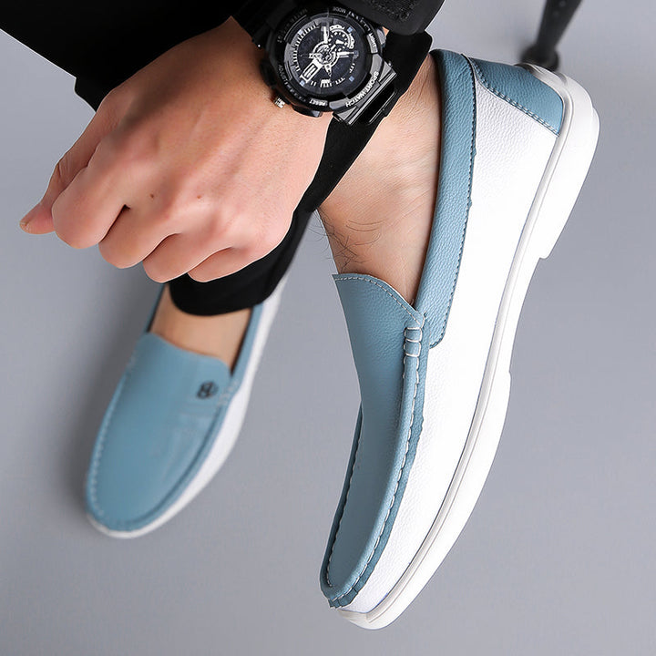 Fashionable men's two-tone slip-on loafers, an essential comfort footwear choice.