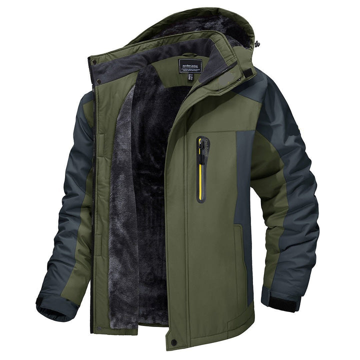Man trekking in a warm, windproof men's winter coat, navigating a snowy trail, staying dry.