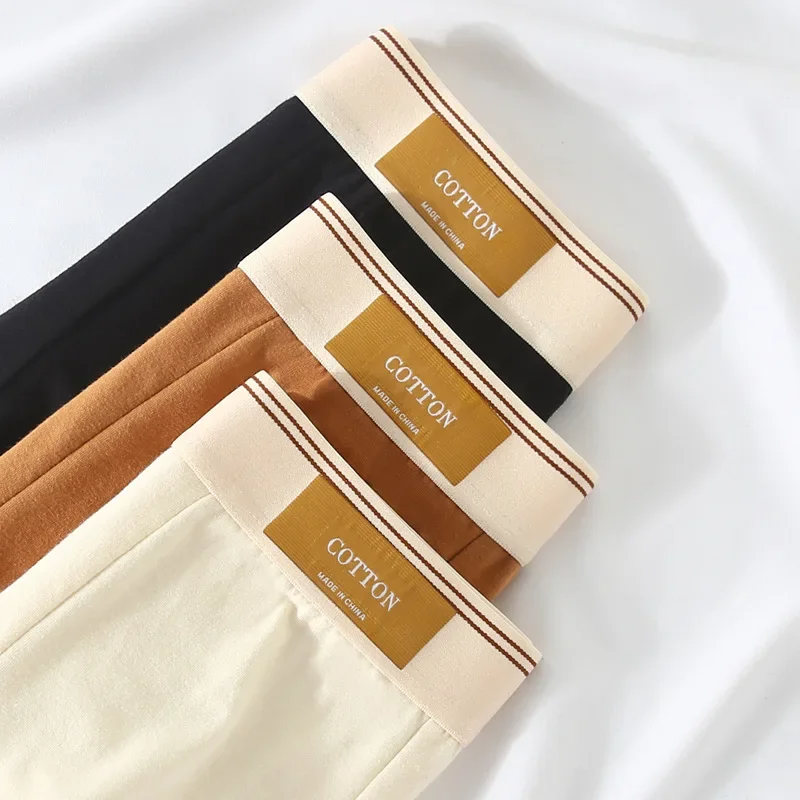 Display of 3 pairs of men's ultimate no-roll boxer briefs, emphasizing their mid-rise and sweat-wicking comfort.