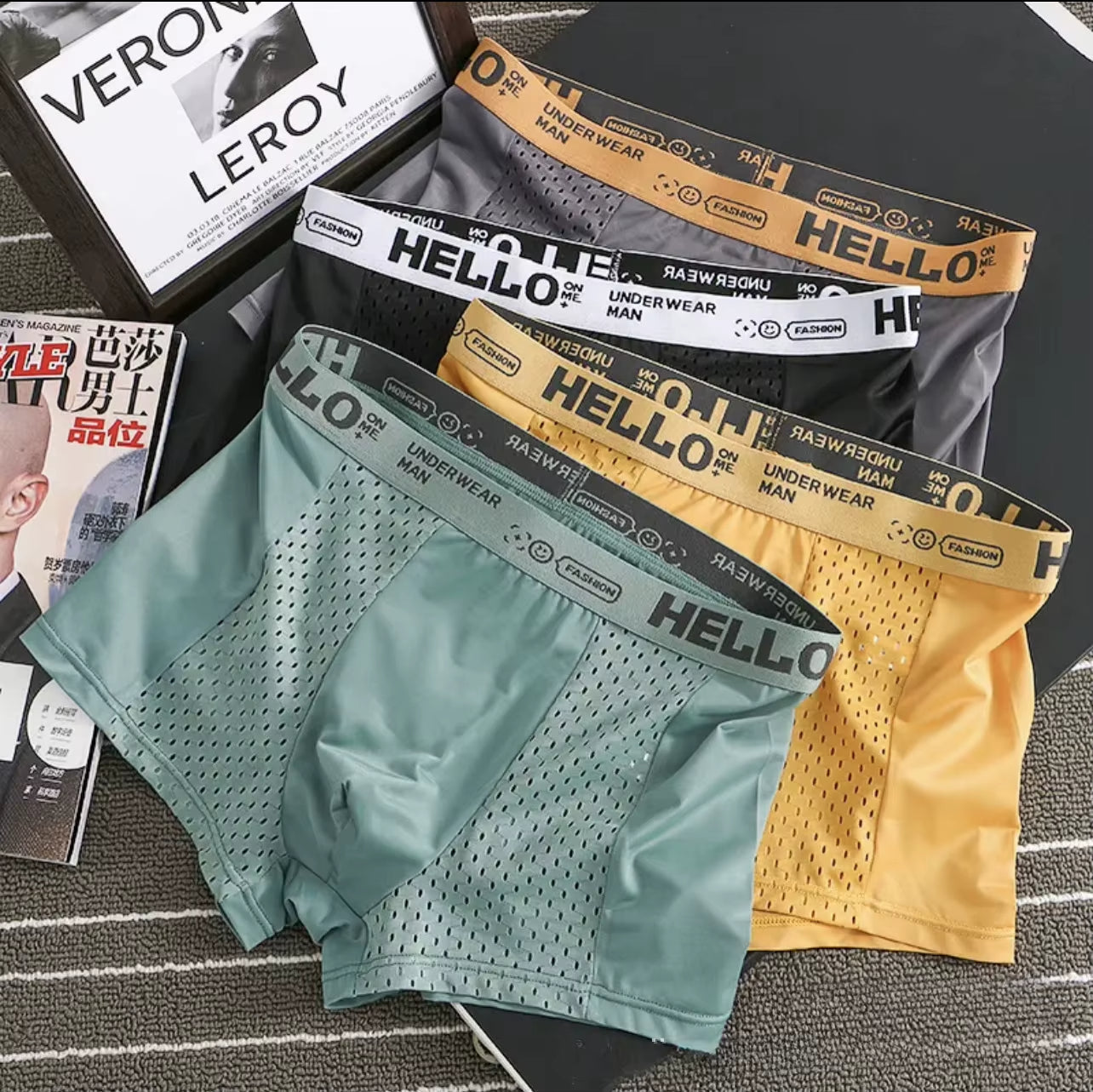 Packaging for men's ultra-breathable mesh boxer briefs 3/4-pack, ready for comfort & activity.