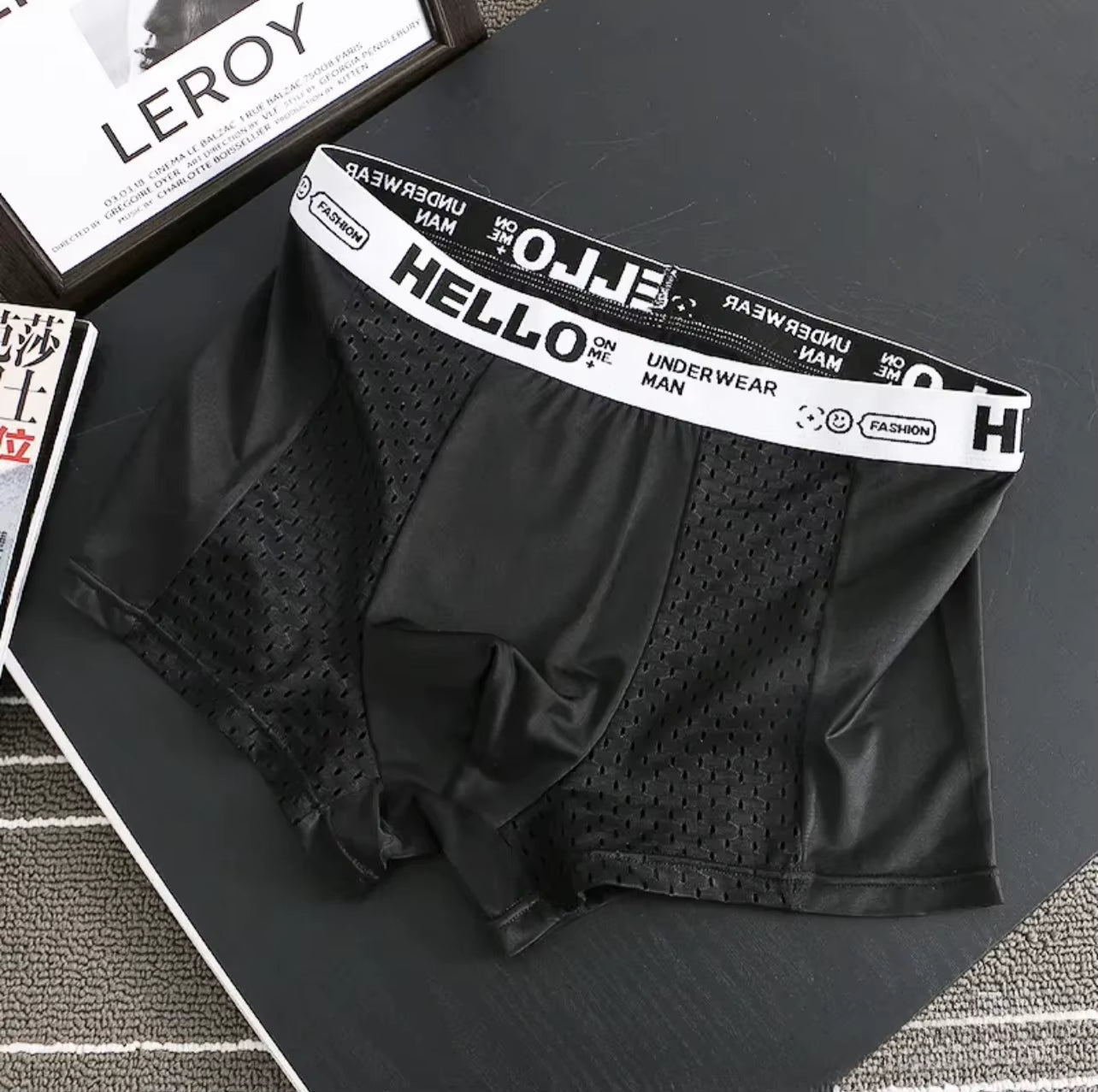 Assorted colors of men's ultra-breathable mesh boxer briefs in a multi-pack, offering everyday comfort.