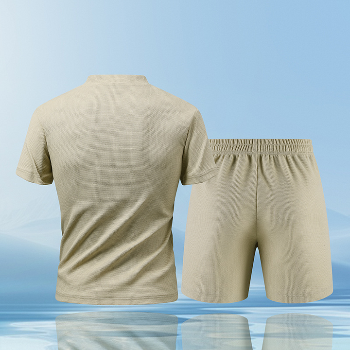 Stylish men's quarter-zip Piqué top, part of a breathable lounge set for ultimate comfort.
