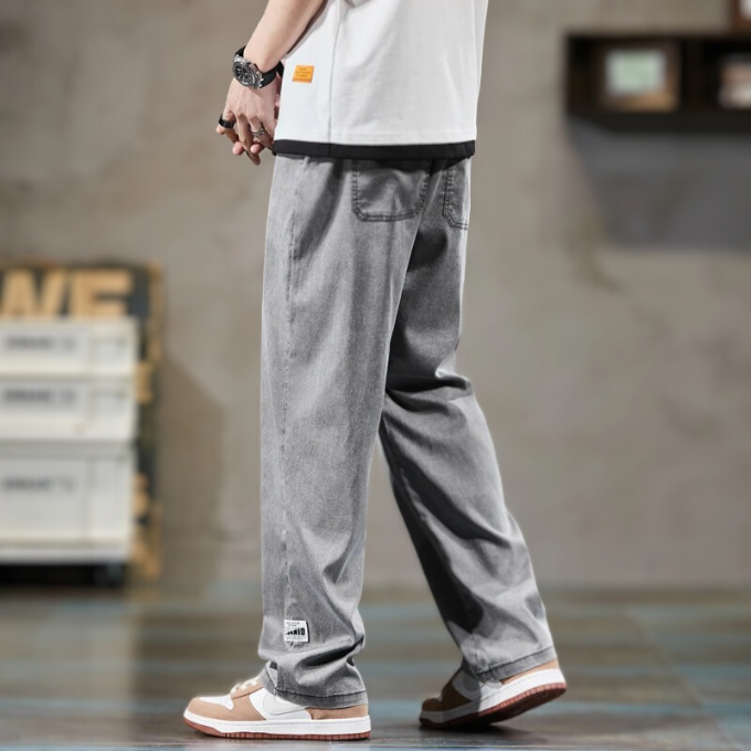 Close-up of men's straight leg lounge pants in relax fit. Highlights elastic waist, drawstring & soft fabric.