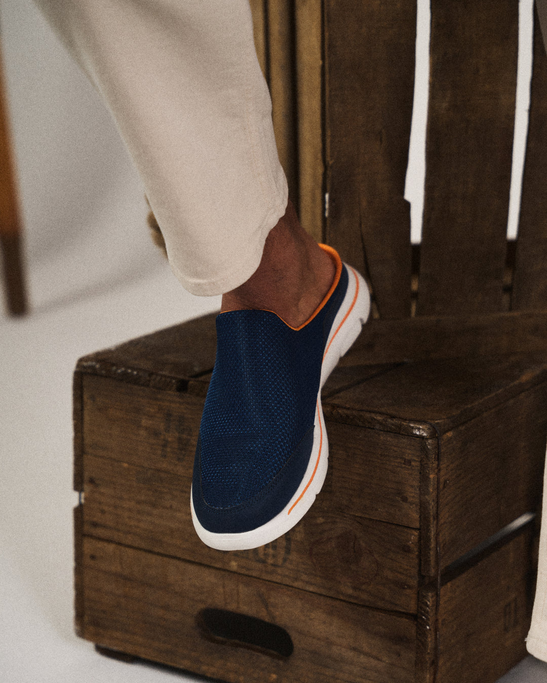 Stylish men's slip-on sneaker slides, a blend of sneaker comfort and sandal ease for summer.