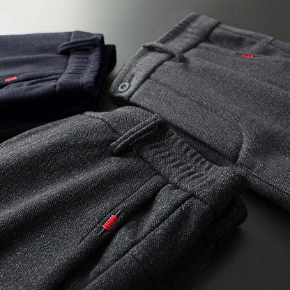 Men's straight-leg casual pants, featuring ultra-comfort and a classic zipper fly.