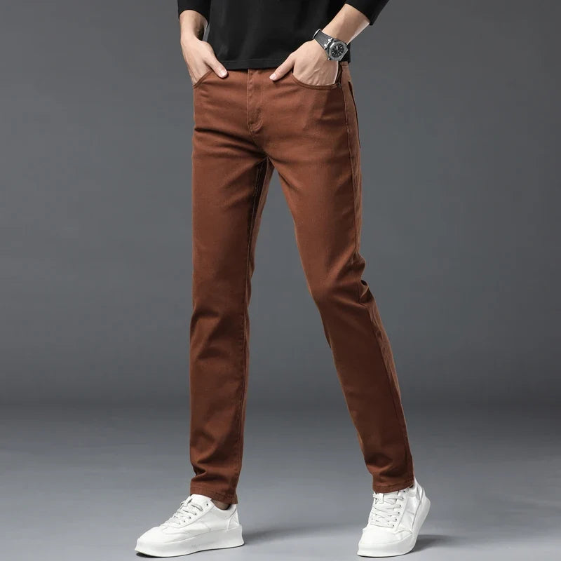 Dark wash men's stretch denim jeans, wrinkle-resistant and comfortable for everyday style.