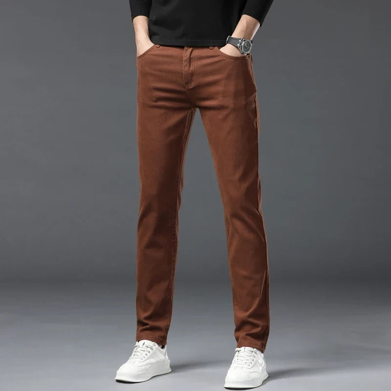 Close-up of comfortable stretch denim fabric on men's jeans, highlighting flexibility & quality.