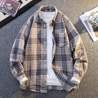 Folded ultra-soft men's plaid button-up shirt, highlighting its warmth and non-bulky design.