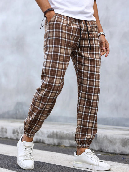 Street style men's tapered fit plaid joggers. Soft flannel for urban casual outfits & comfort.