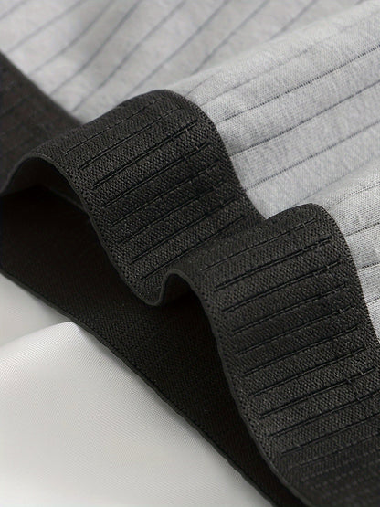 Detail shot of ultra-soft ribbed modal fabric on men's boxer briefs, highlighting luxurious feel.