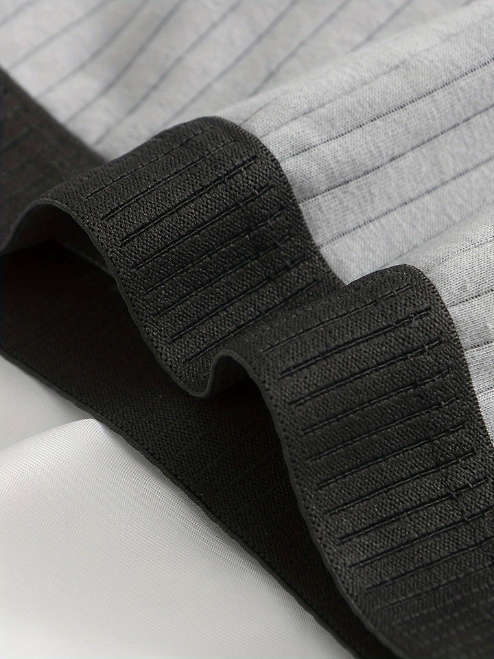 Detail shot of ultra-soft ribbed modal fabric on men's boxer briefs, highlighting luxurious feel.