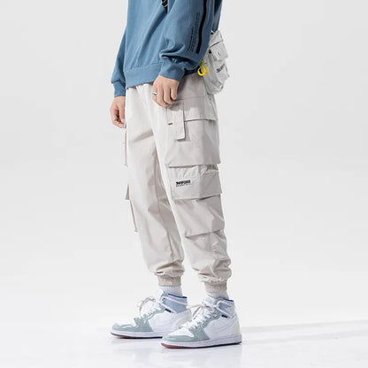 Oversized fit men's joggers, combining athletic style with cargo pants functionality.
