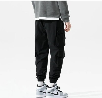 Cool men's fashion joggers, blending cargo pant utility with a relaxed, athletic style.