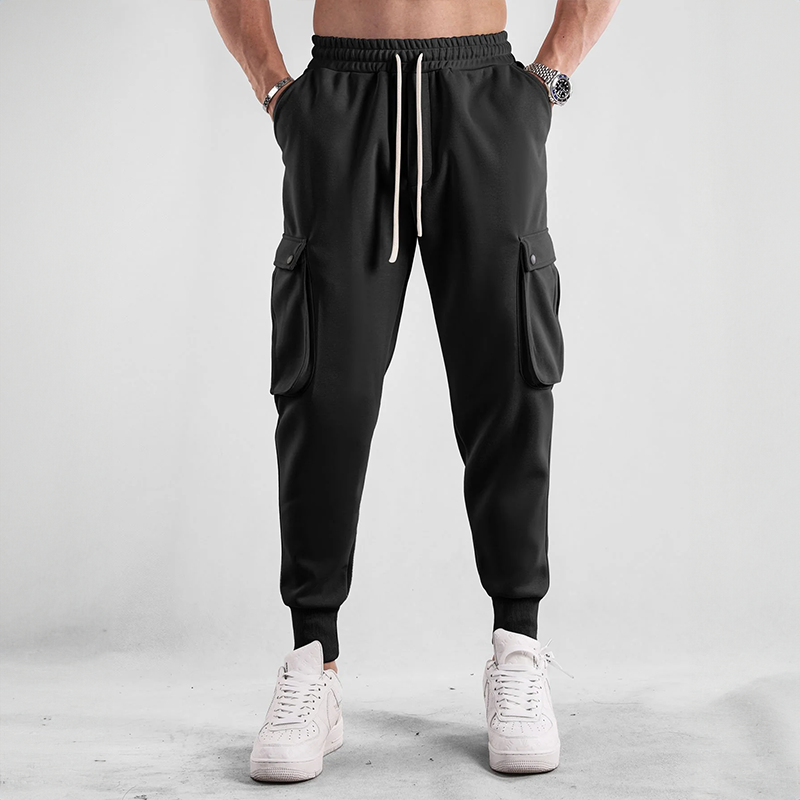 Man relaxing in comfortable Urban Flex Cargo Joggers, ideal loungewear & everyday bottom wear.
