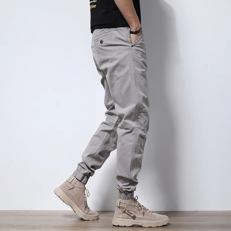 Close-up of reinforced stitching on Men's Urban Cargo Joggers; highlighting durability & quality for active use.