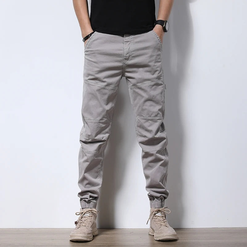 Modern men's reinforced cargo joggers, featuring urban style, comfort fit, and durable stretch fabric for everyday.