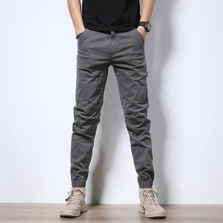 Men's practical reinforced cargo joggers with multiple pockets; perfect for urban adventures and everyday utility.