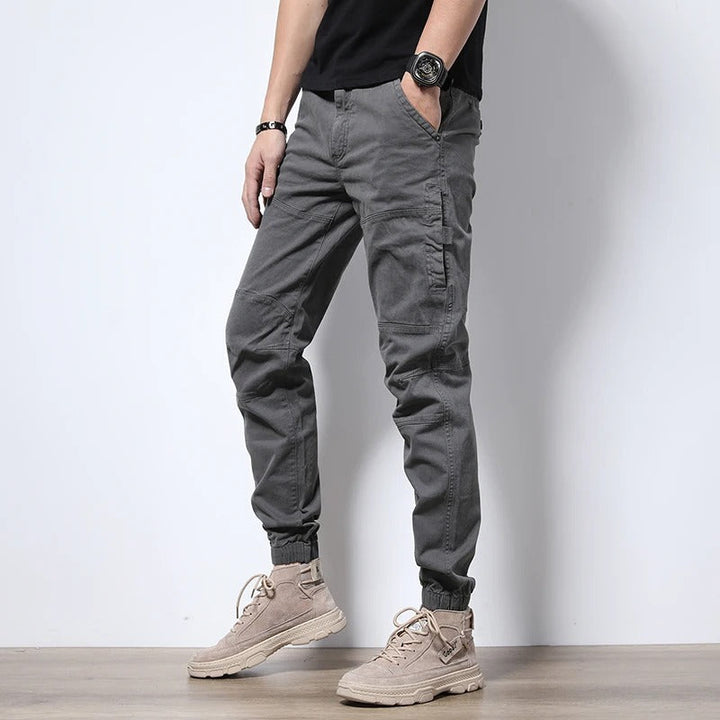 Urban style men's reinforced cargo joggers; durable, comfort fit, stretch pants, ideal for active & everyday wear.