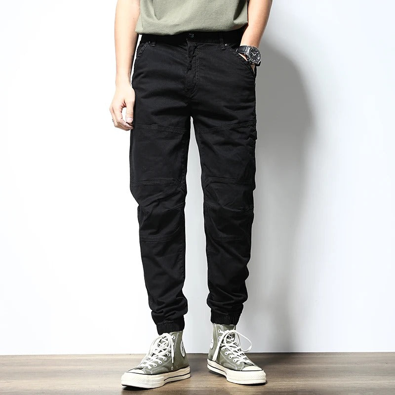 Men's stretch cargo joggers, reinforced for durability; perfect activewear for urban adventures & casual comfort.