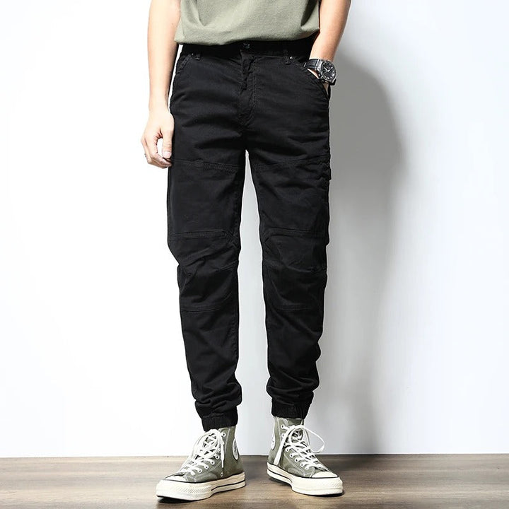 Men's stretch cargo joggers, reinforced for durability; perfect activewear for urban adventures & casual comfort.