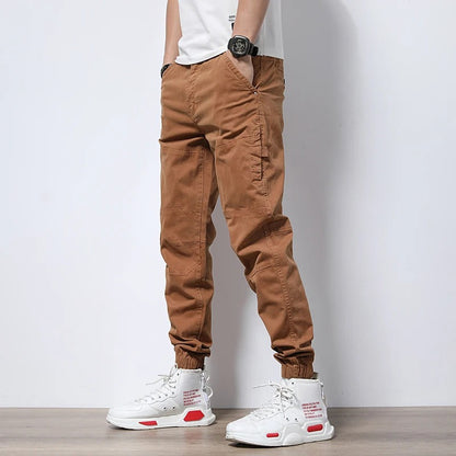 Durable men's reinforced cargo joggers, designed for urban exploration & long-lasting comfort; stretch fabric.