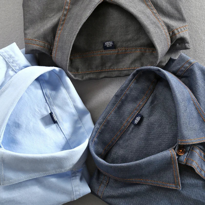 Stylish men's urban polo shirt featuring a classic collar, button placket, and dual chest pockets.