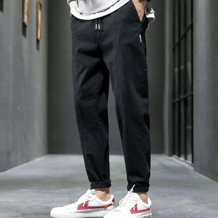 Modern men's tapered joggers, combining athletic wear functionality with everyday comfort for urban casual style.