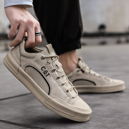 Khaki men's comfort sneakers, close-up view showing durable sole and versatile design.