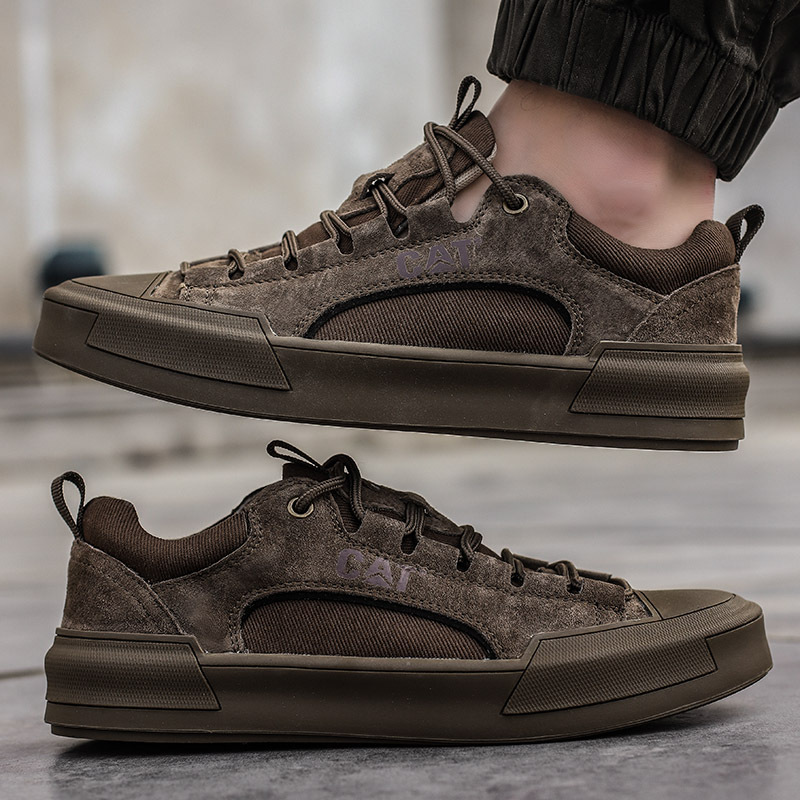 Close-up of texture on men's khaki casual sneakers, highlighting durable materials and urban style.