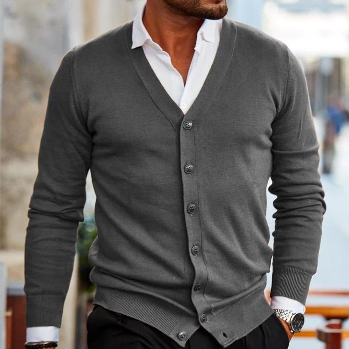 Folded men's V-neck button cardigan knitwear, ready for fall/winter layering, a classic men's fashion piece.
