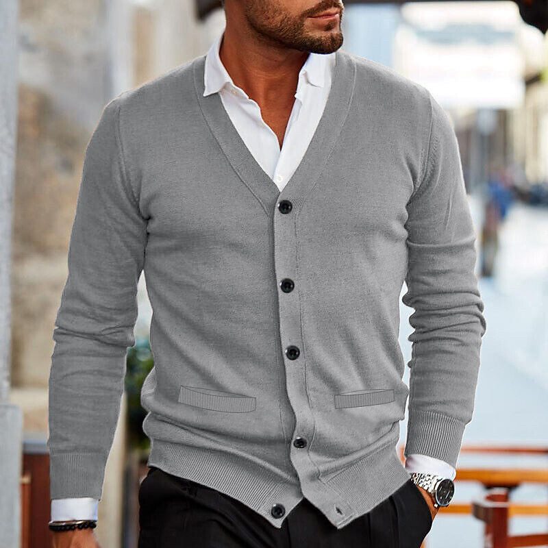 Detailed view of the V-neck and button-front on a men's knit cardigan, essential for smart casual outfits.