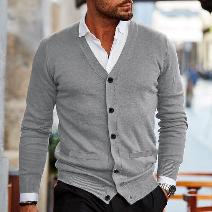 Detailed view of the V-neck and button-front on a men's knit cardigan, essential for smart casual outfits.