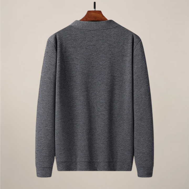Stylish men's knit V-neck cardigan with soft texture, front buttons & practical pockets, perfect for layering.
