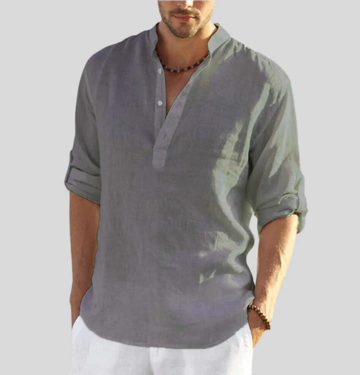 Man wearing a lightweight V-neck short sleeve button-up shirt. Ideal casual summer wear with a relaxed fit.