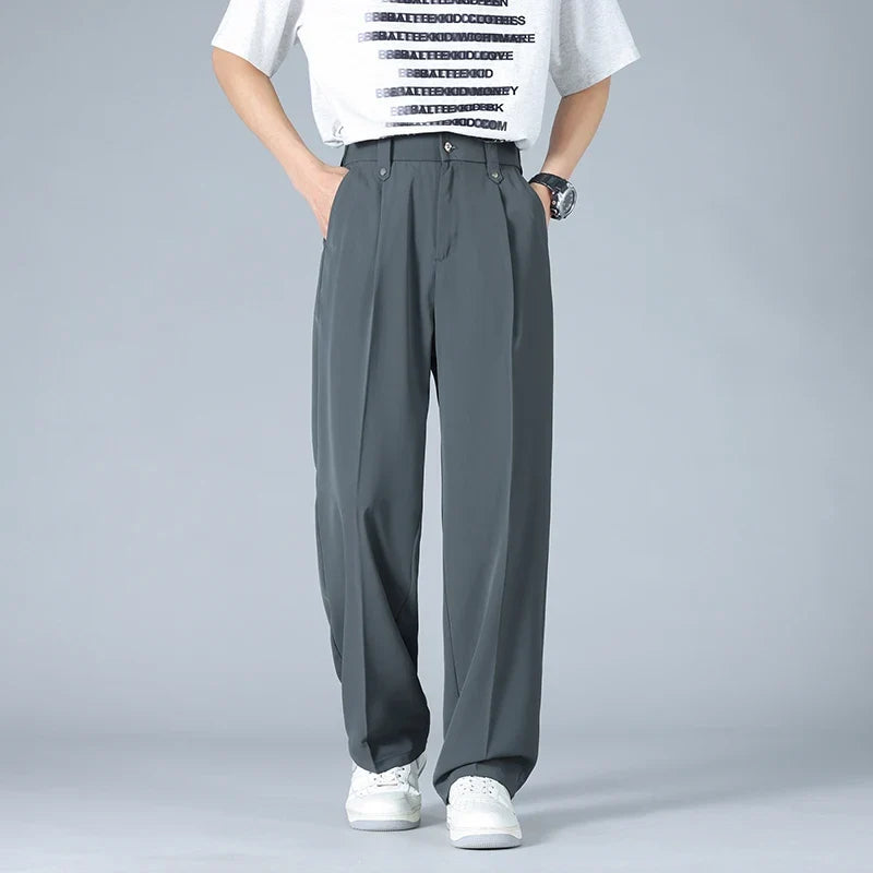 Stylish men's Vallier relaxed fit trousers, featuring a smart pleated front for a modern, everyday look.