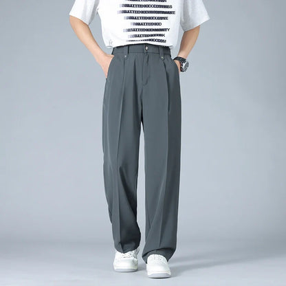 Stylish men's Vallier relaxed fit trousers, featuring a smart pleated front for a modern, everyday look.
