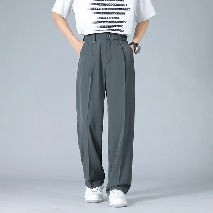 Stylish men's Vallier relaxed fit trousers, featuring a smart pleated front for a modern, everyday look.