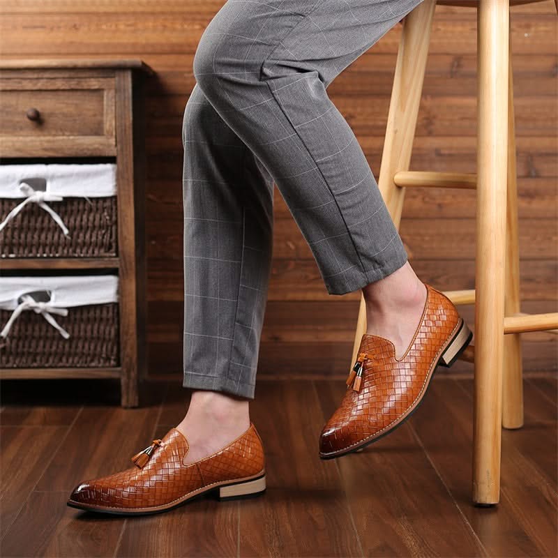 Elegant black men's woven dress loafers by Valtieri. Tasseled for a sophisticated formal look.