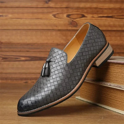 Men's Valtieri black woven slip-on loafers. Tassel detail, comfortable and stylish for work or events.