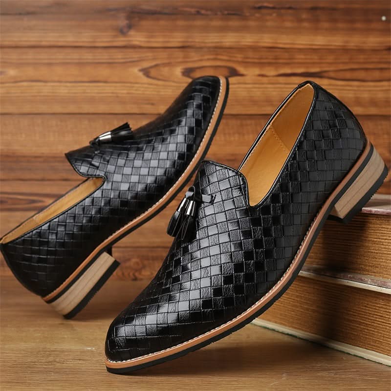 Classic men's slip-on tassel loafers. Brown woven texture, formal yet comfortable footwear.