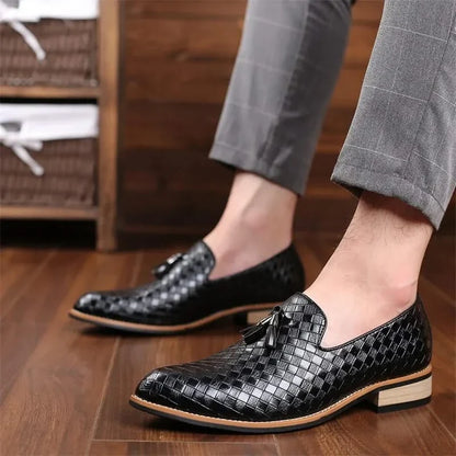 Close-up of men's Valtieri woven tassel loafers. Tan leather, comfortable & stylish slip-on footwear.