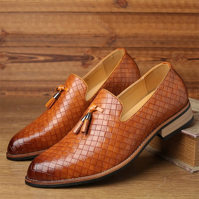 Stylish men's Valtieri woven loafers. Black leather, tassel accents, perfect for business casual attire.